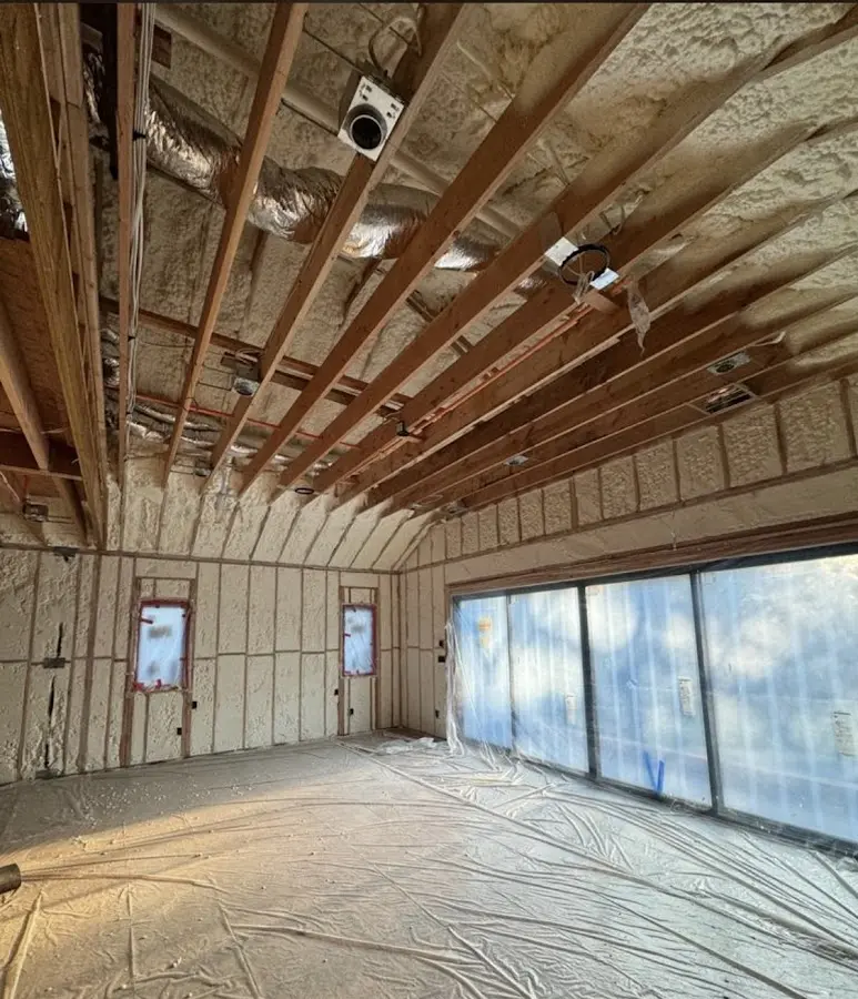 Interior walls and ceiling insulated with spray foam during new construction in West Windsor